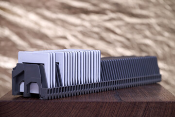 Slide rack for projection against golden background