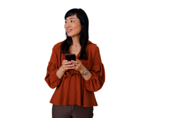 Asian woman using smartphone, looking away and smiling, browsing social media, connecting with technology, transparent background