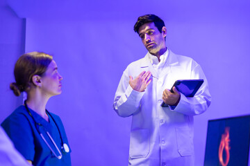 Hispanic man doctor teaching, Medical Training Presentation. Hospital Medical Research. Group of Doctor, nurse and healthcare professional meeting sitting boardroom, Planning and brainstorming health
