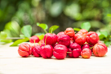 acerola cherry on wood top table