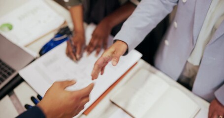 Business people, architect and team with handshake, documents or agreement for construction deal. Top view, colleagues or group shaking hands with paperwork, design or b2b for building partnership