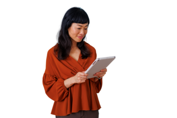 Asian woman using digital tablet, smiling while working or learning, enjoying online communication with transparent background