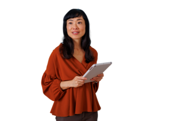 Asian professional woman reviewing information on her tablet, thinking about innovative business strategies and technology