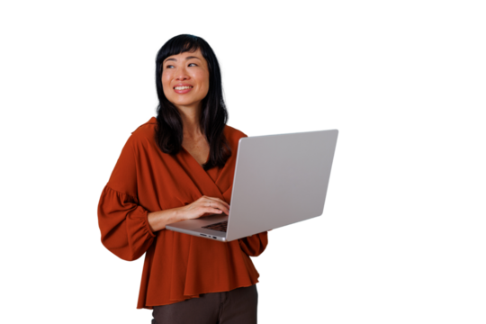 Asian businesswoman smiling and working on a laptop, using technology for professional communication on transparent background - Powered by Adobe