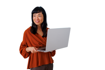 Asian businesswoman smiling, holding a laptop, standing for modern corporate work, technology, connectivity, and communication