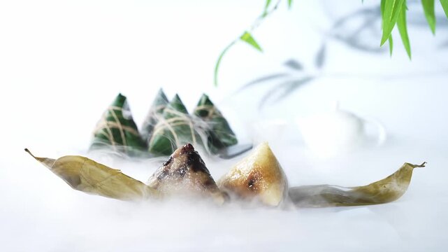 Traditional Asian Rice Dumplings Wrapped in Bamboo Leaves with Steam