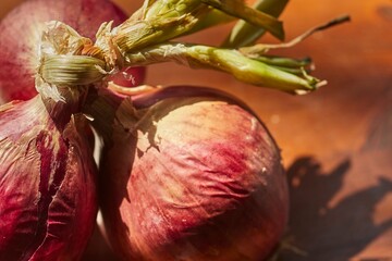 A bunch of raw, whole, red onions