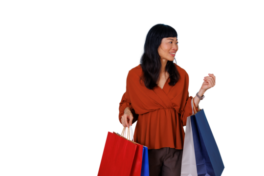 Asian woman carrying shopping bags, smiling and enjoying shopping, consumerism, retail, purchase, transparent background - Powered by Adobe