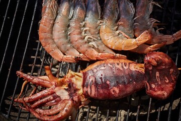A cuttlefish and some shrimp on the grill at a Thai food festival in Virginia, USA