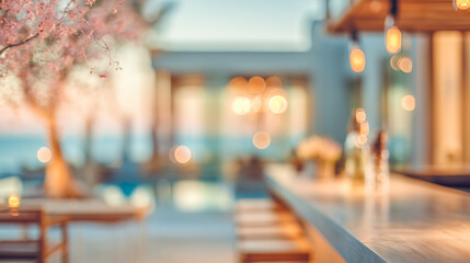 Empty open space,  restaurant and bar at the ocean. Motion blur, warm tones, abstract defocused background. Concept image of travel.