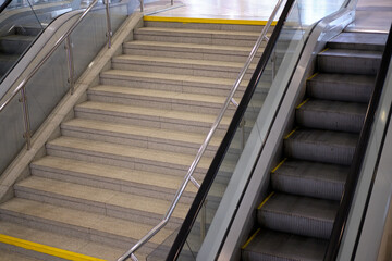 Stairs next to the escalator for lifting people