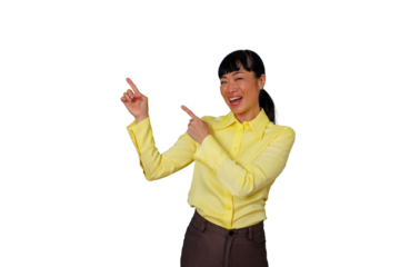 Asian woman pointing fingers, introducing and presenting a concept with excitement and a friendly smile