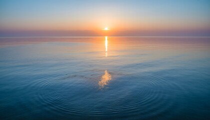 Minimal seascape of a calm ocean at sunrise with warm reflection on the horizon—serene nature background with generous copy space