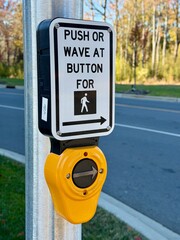 Push or wave crosswalk button with a shallow depth of field