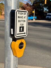 Push or wave crosswalk button with a shallow depth of field