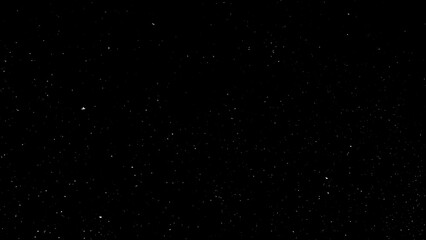 Freeze motion of natural snow falling on black background