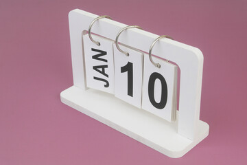 January, 10 on calendar on purple background.	