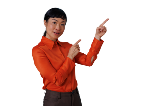 Asian woman pointing both index fingers up and to the right, presenting or showing information, transparent background