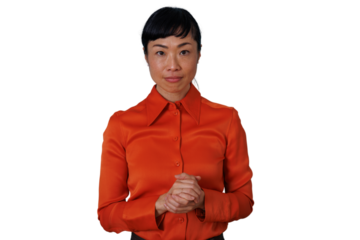 Asian businesswoman with attentive expression standing, ready to listen or present, hands clasped, transparent background