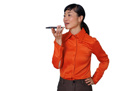 Asian woman speaking into smartphone using voice assistant or speakerphone, hands-free communication with transparent background