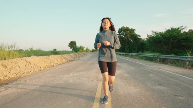 Teenage Girls running in country road.
