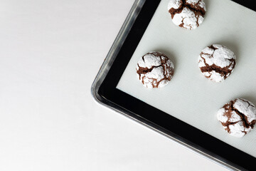 Chocolate Crinkle Cookies on baking sheet