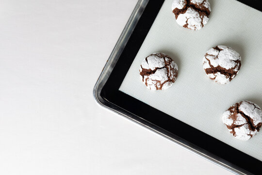 Chocolate Crinkle Cookies on baking sheet
