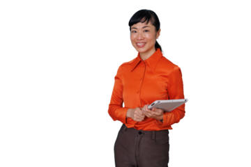 Asian businesswoman smiling and holding a tablet, standing, looking at camera, using mobile technology for business tasks