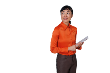 Asian businesswoman in orange shirt holding documents and looking away on transparent background
