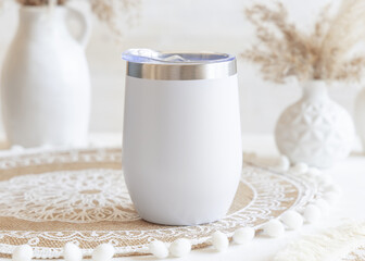 White stainless steel 12oz tumbler on boho placemat near pampas grass Closeup, mockup
