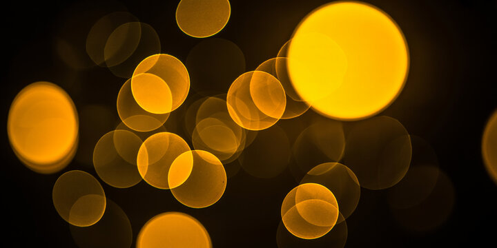 Out of focus yellow circles of light against a dark background bokeh blurred Modern Digital Business Solution and Corporate Efficiency Concept, - Powered by Adobe