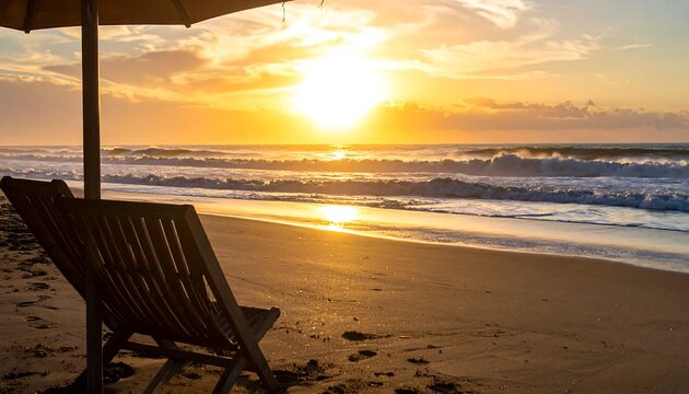 Tranquil beach scene with a beach chair under an umbrella, bathed in the warm glow of the setting sun