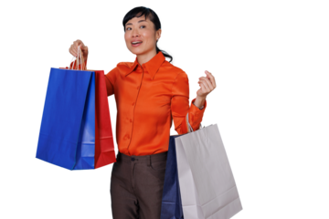 Happy asian woman holding colorful shopping bags after successful retail therapy, enjoying consumerism, transparent background