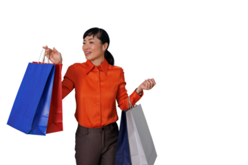 Asian woman holding shopping bags, happy consumer finding sale bargains, enjoying retail therapy with purchases, transparent background