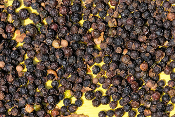 background of black pepper Shows a pile of coffee beans. Full-frame composition, brown-black tone....