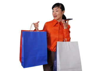Asian woman holding shopping bags and speaking on phone, shopping and retail communication on transparent background