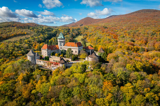 Aerial View of Smolenice Castle Surrounded by Colorful Autumn Forests in Slovakia Capturing Scenic Hills, Trees, and the Historic Medieval Landmark from Above - Powered by Adobe