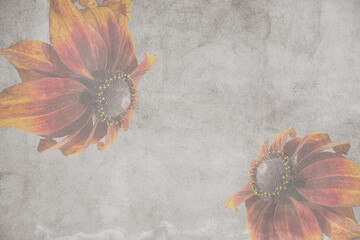 A textured, aged gray background featuring two opposing, softly faded rudbeckia flowers in the corners, creating a worn, decorative frame with ample central copy space.
