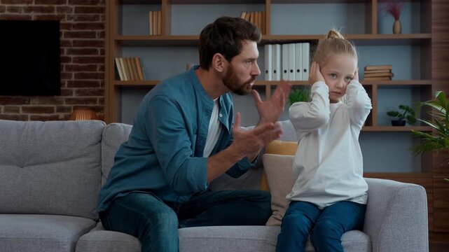 Caucasian family quarrel agressive father talk shouting to frustrated daughter closing covering ears domestic violence punishment dad scolding unhappy little child kid girl suffering conflict problem