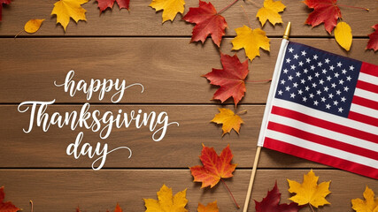 Happy Thanksgiving Day calligraphy with an American flag and autumn leaves on a wood table, a perfect design for a patriotic holiday greeting card