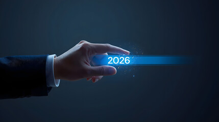 Business professional activates future year 2026 with glowing digital interface, signaling progress and innovation in corporate strategy.