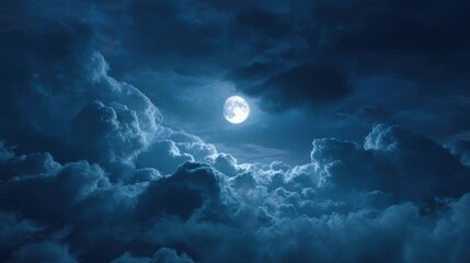 Full moon shining brightly through dark, cloudy night sky over serene landscape
