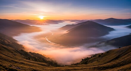 A breathtaking view of rolling hills and mountains during sunrise with clouds and mist filling the valleys below