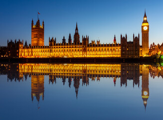 Houses of Parliament with Big Ben tower and Westminster bridge at sunset, London, UK