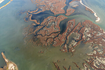 Drone view of dried river channels and marshes depicting severe water shortage and climate crisis