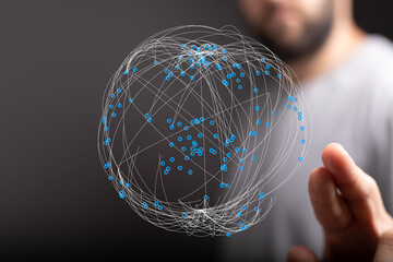 A person holding a digital globe, symbolizing global networks, connection, and data visualization. Representing ideas of communicatio
