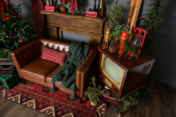 Vintage Living Room decorated for Christmas with brown leather couch and red and green holiday decor