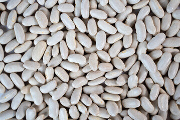 Close-up of white beans forming natural texture, ideal for vegan food concepts, healthy diet visuals, or agricultural themes. 