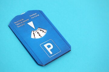 Parking disc for windshield. Limited time parking system in european countries. Concept of parking time count in busy parking lots