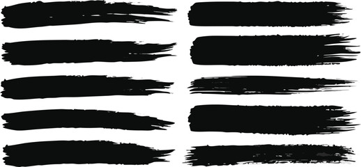 Black grunge paint brush stroke elements set on white backdrop